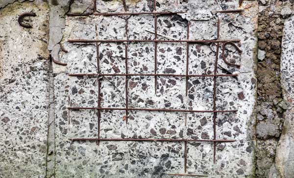 Concrete surface with visible joints and reinforcement bars