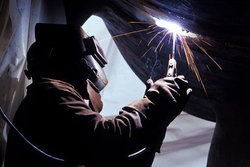 Welder working with a welding torch