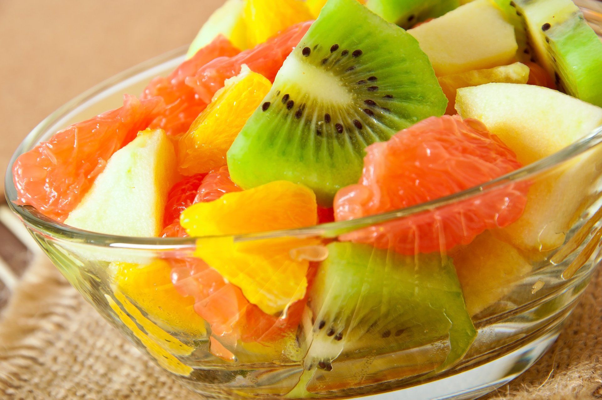 sliced fruit in a glass bowl