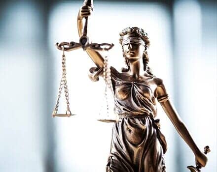 Statue Holding Scale And Sword — Law Firm in Warren, PA