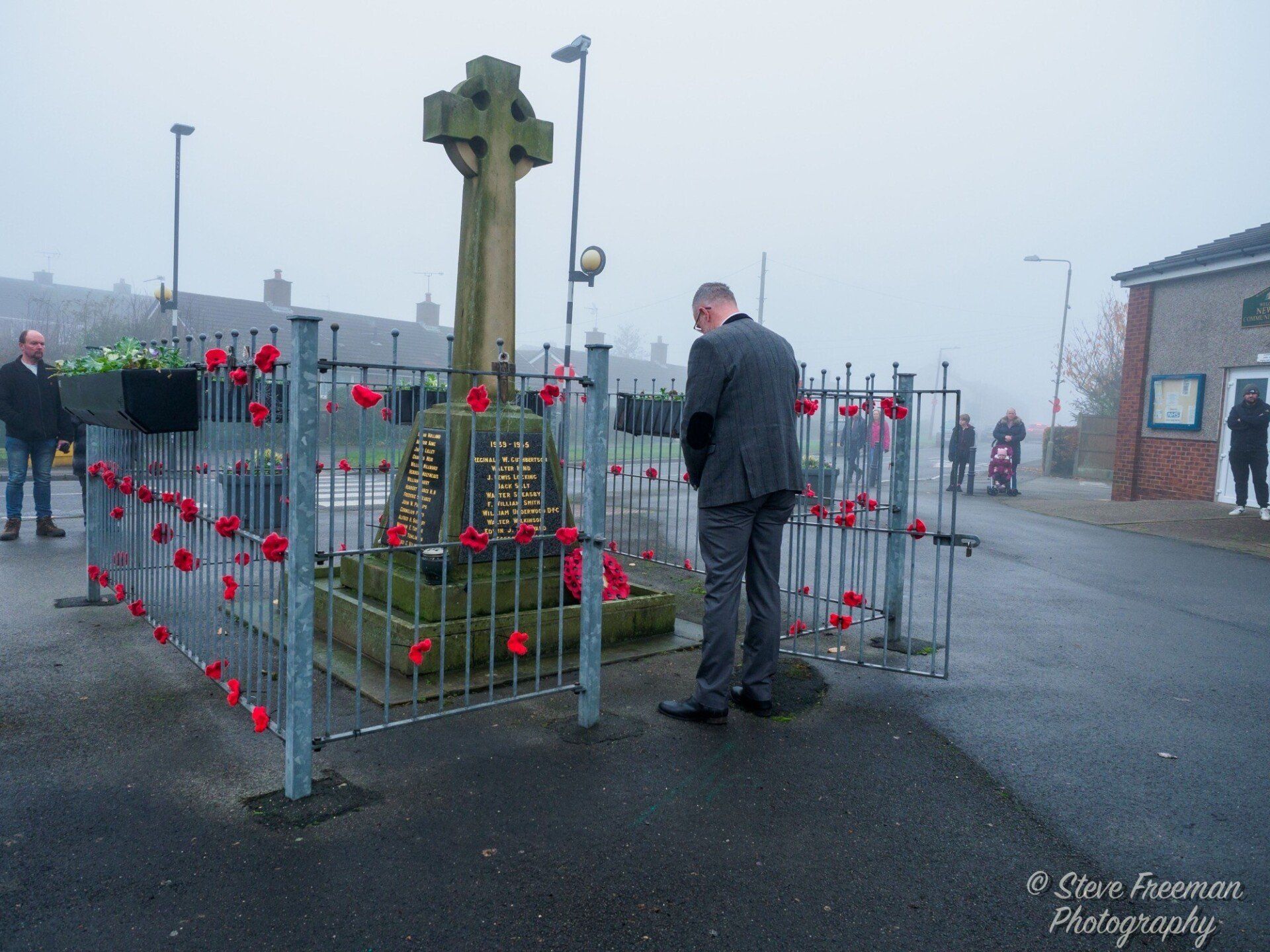 Laying wreaths at the memorial in Newton