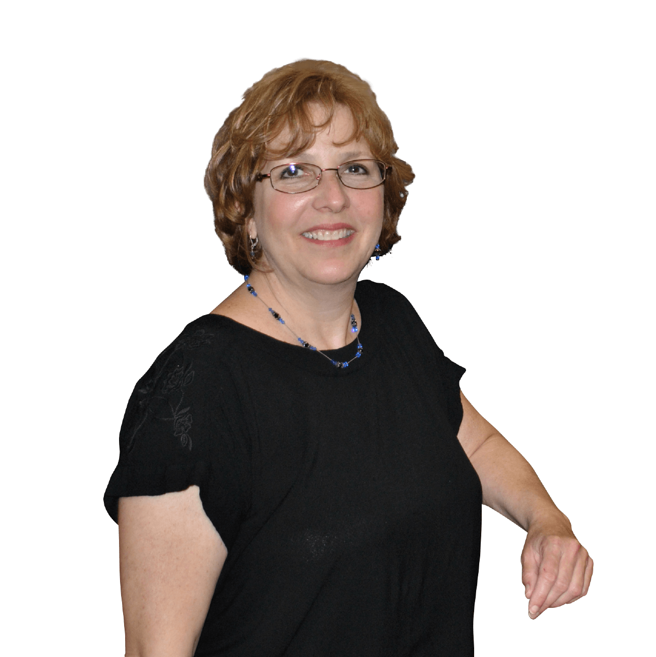 A woman wearing glasses and a black shirt smiles for the camera