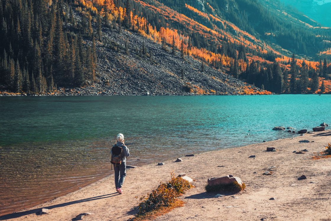 Woman walking by lake