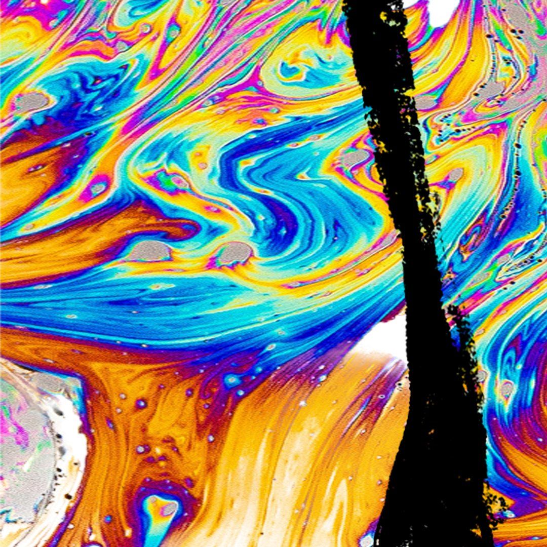 Abstract, colorful soap bubble surface with black stroke across.