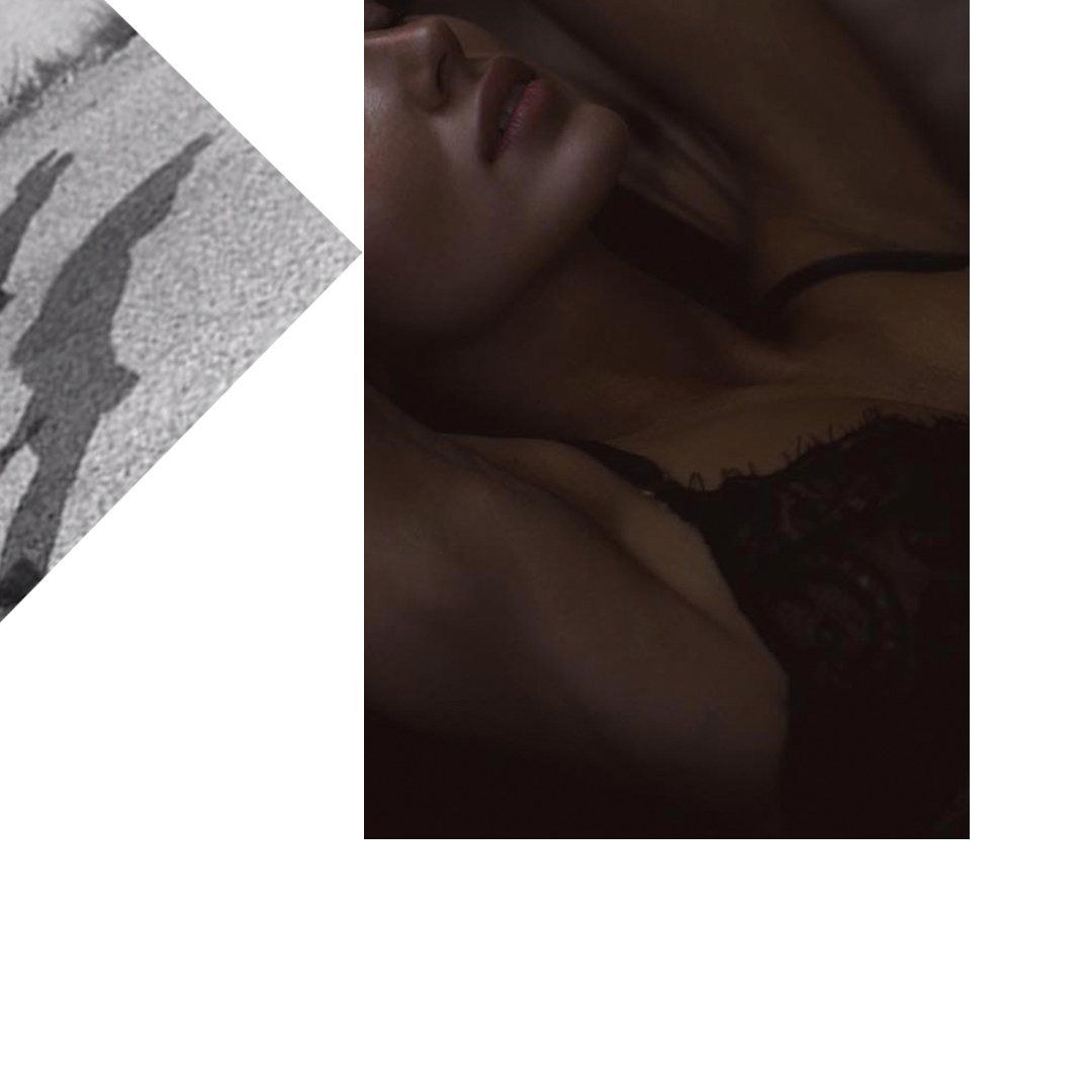 Woman reclining, wearing black lace top. Shadows on left side, close-up, dimly lit.