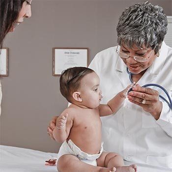 Doctor Checking Up a baby — Doctor in Smyrna, TN Doctor Checking Up a baby — Doctor in Smyrna, TN