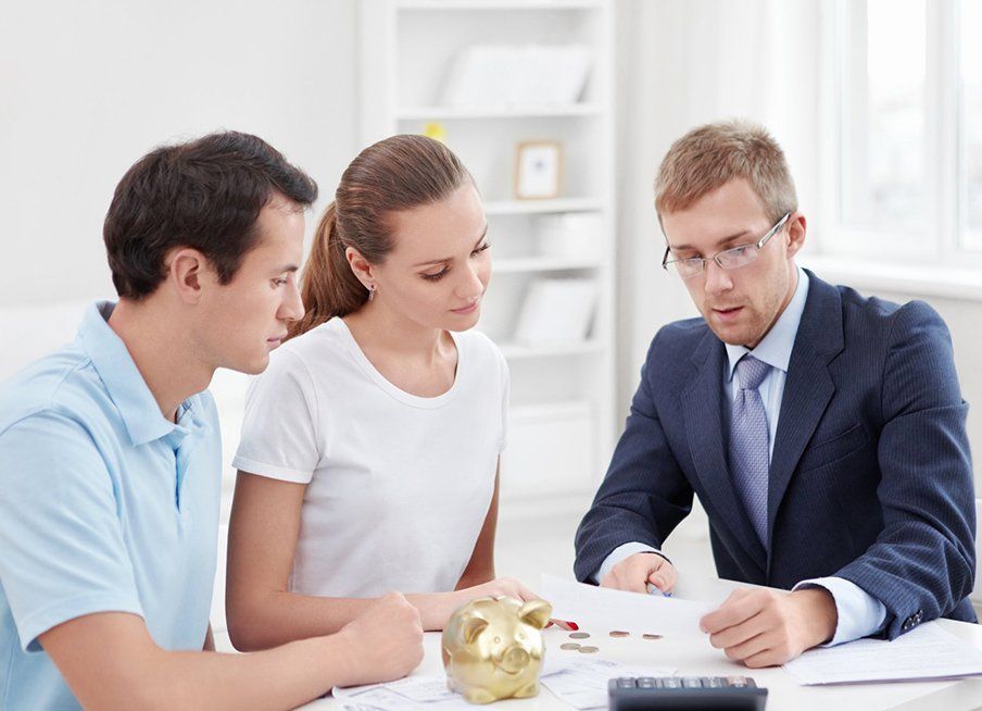 Professional Discussing Investments To The Couple — Outback Conveyancing Services in Alice Springs, NT Professional Discussing Investments To The Couple — Outback Conveyancing Services in Alice Springs, NT