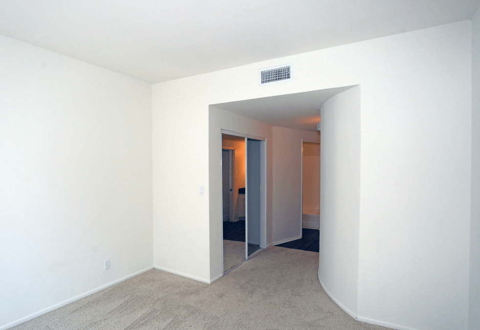 bedroom with view of closet