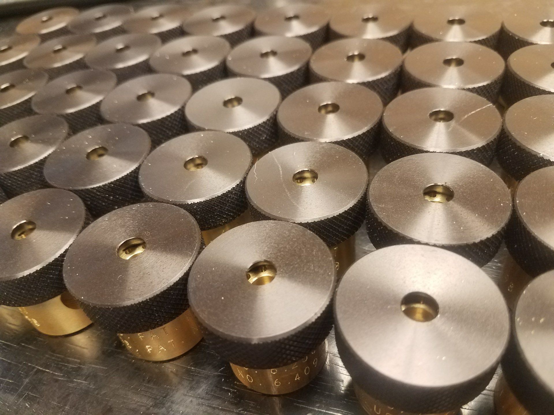 A bunch of metal circles with holes in them