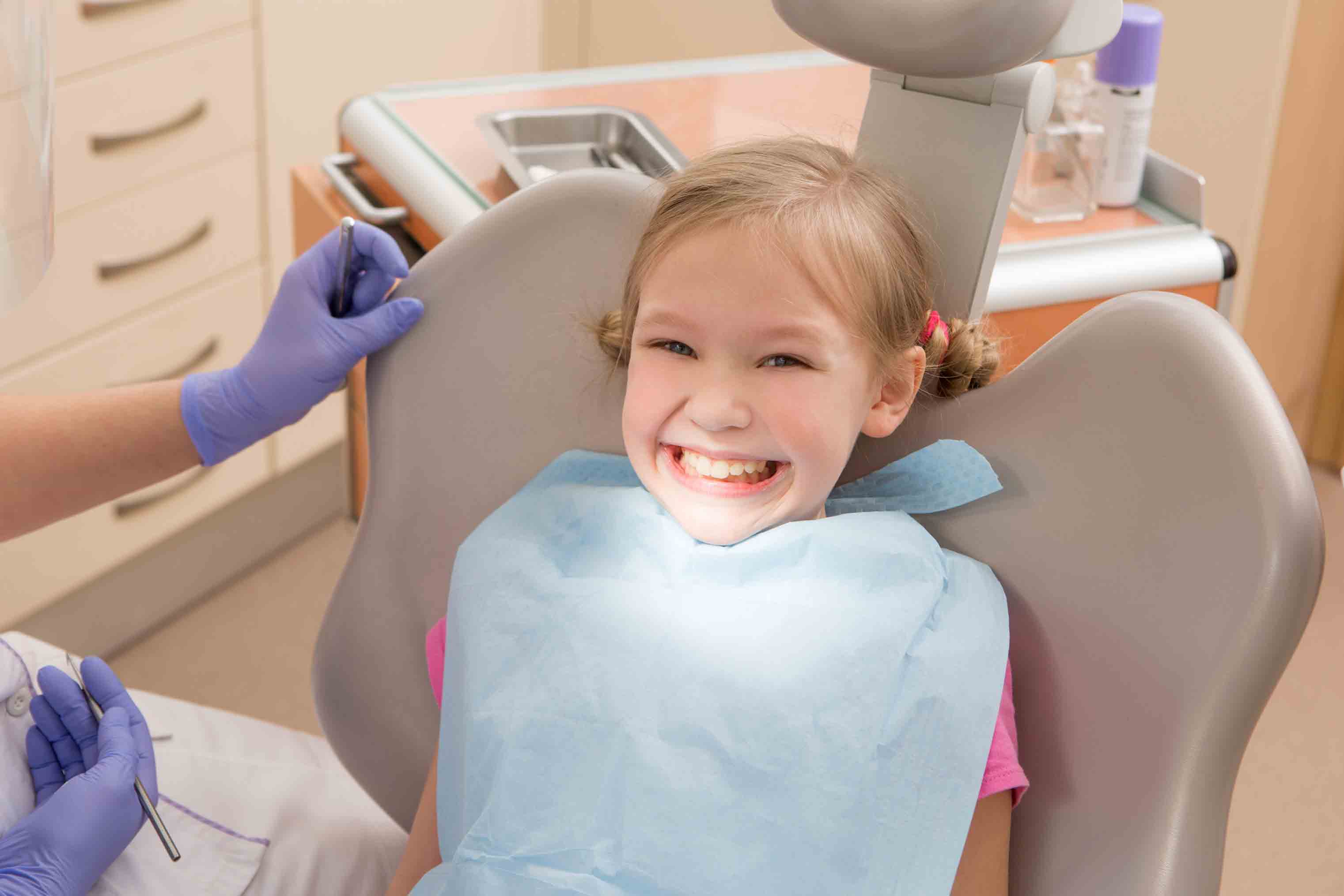 child smiling at dentist