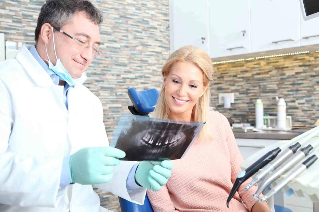 checking teeth at dentist office