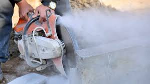A Man Using Chainsaw — Asbestos Removal & Demolition Specialists in Wide Bay & Sunshine Coast