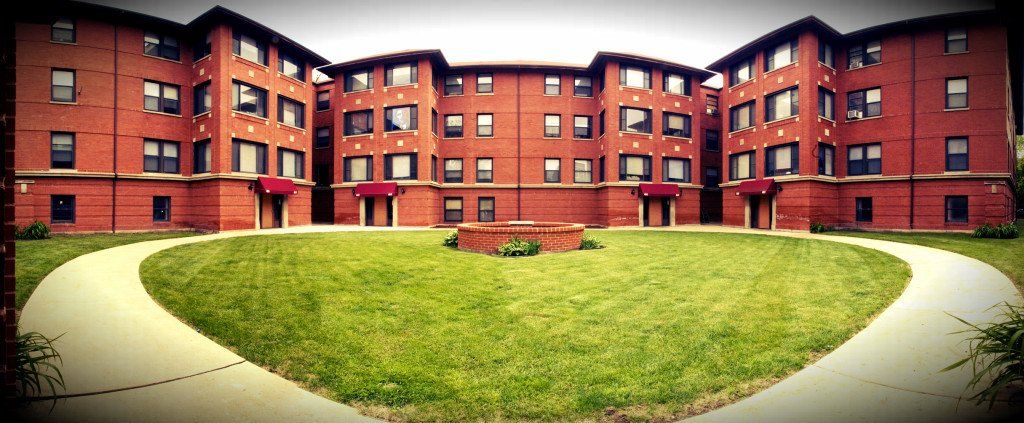 Red building with courtyard area outside