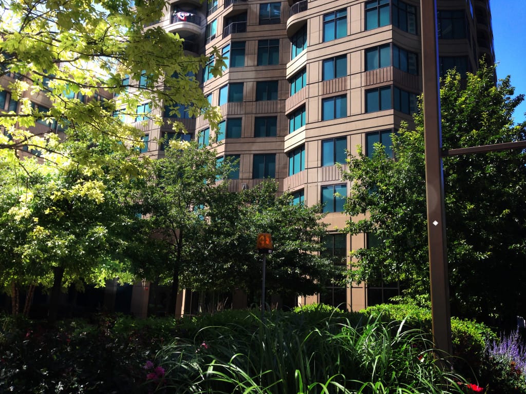 High rise building with vegetation outside