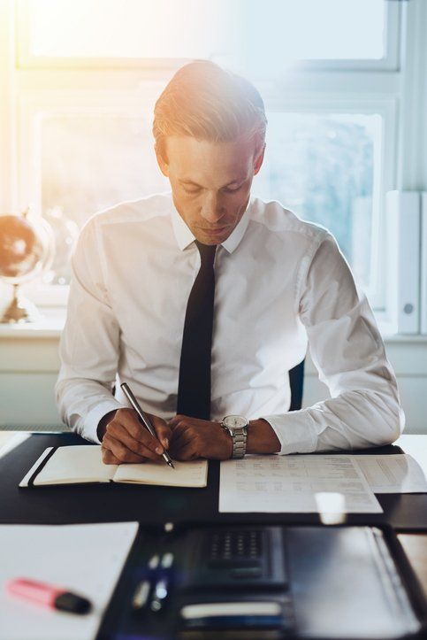 White male executive working at office