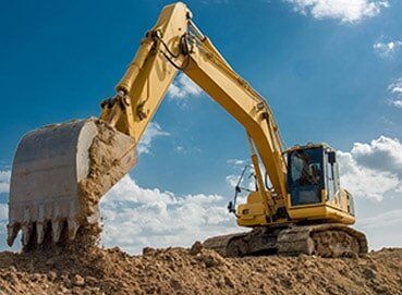 Excavator blue sky heavy machine construction site — Asphalt Service in West Bend, WI Excavator blue sky heavy machine construction site — Asphalt Service in West Bend, WI