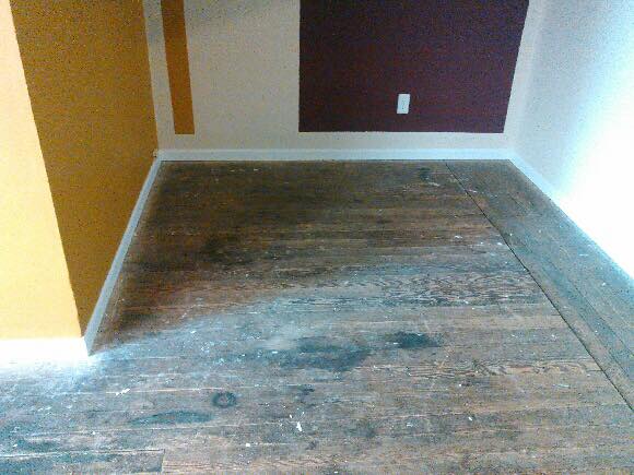 Room Before Repairing Floor — St. Louis, MO — Heritage Hardwood Floors, Inc