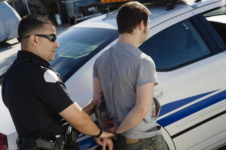 man cought by the police officer