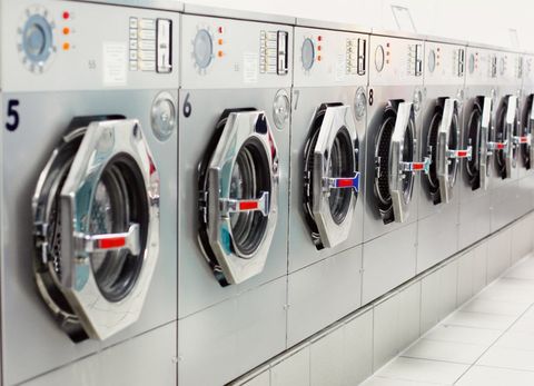 Row Of Washing Machines At Laundromat — Sarasota County, FL — Amerovent Dryer Vent Cleaning Specialists