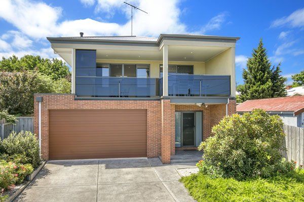 exterior of house with blue railing