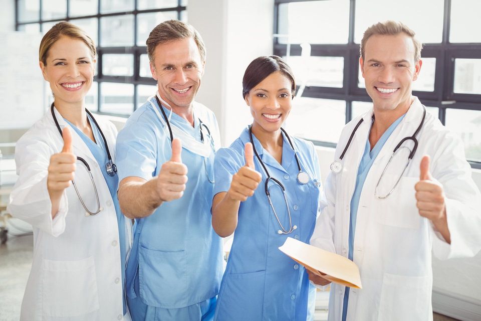 Medical Team Putting Their Thumbs Up And Smiling — Los Angeles, CA — Spiga and Associates Medical Team Putting Their Thumbs Up And Smiling — Los Angeles, CA — Spiga and Associates