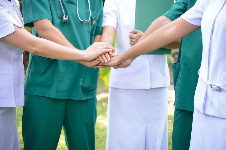 Nurses Putting Hands Together — Los Angeles, CA — Spiga and Associates Nurses Putting Hands Together — Los Angeles, CA — Spiga and Associates