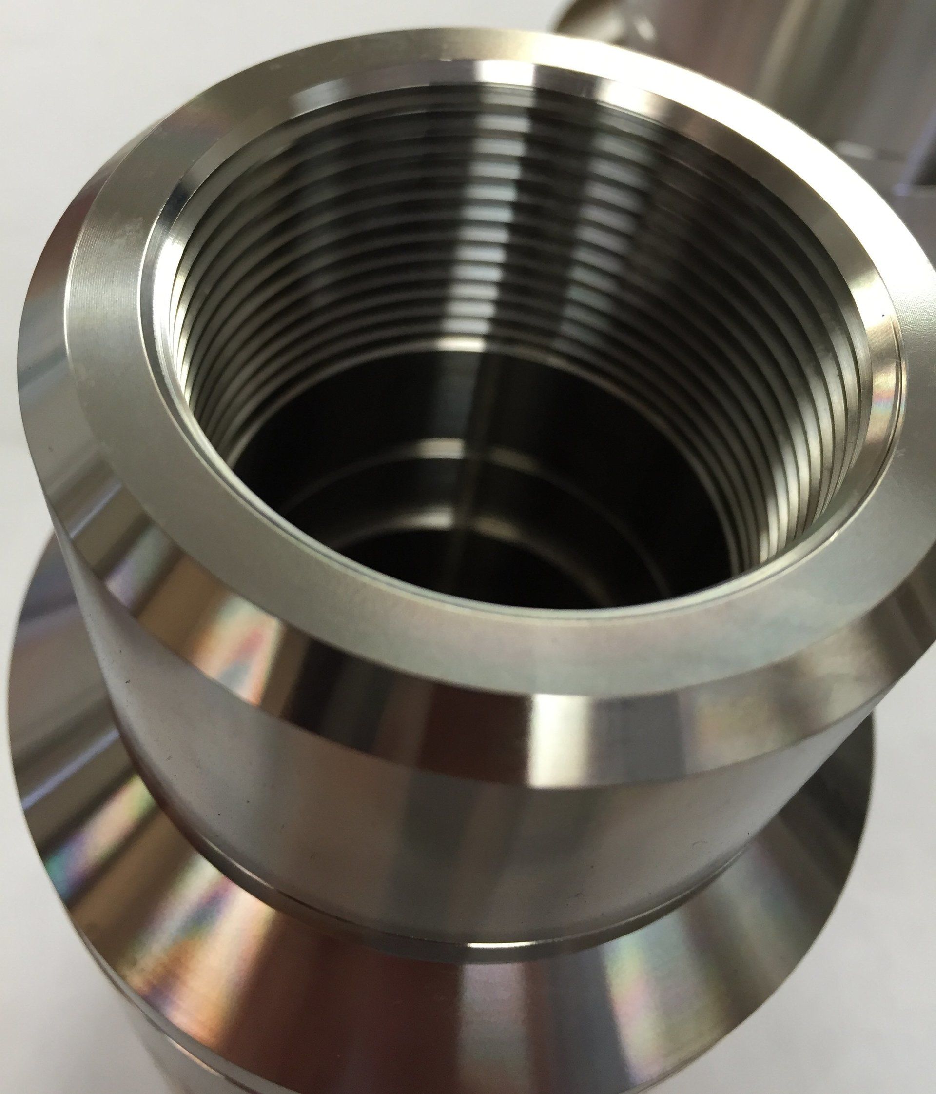 A close up of a metal object with a hole in the middle