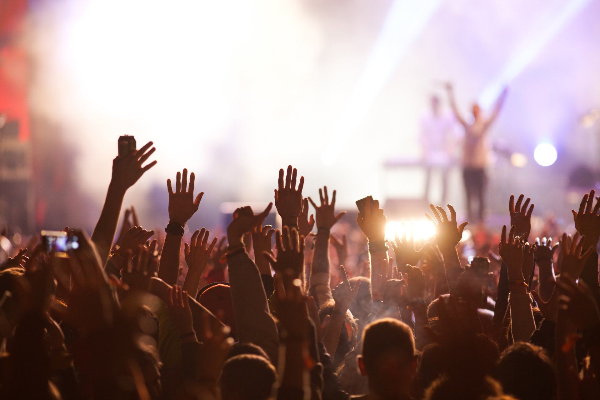 Group of people enjoying a live band event