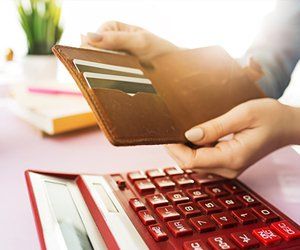 Chapter 128 Bankruptcy — Woman Holding Wallet With Credit Cards in Chicago, IL