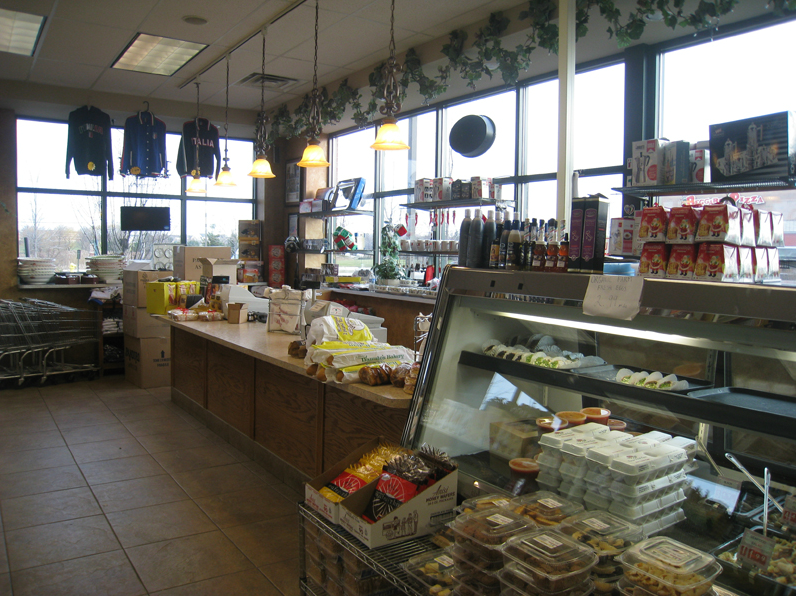 Carryout Products — Store Cashier with bunch of products in Orland Park, IL