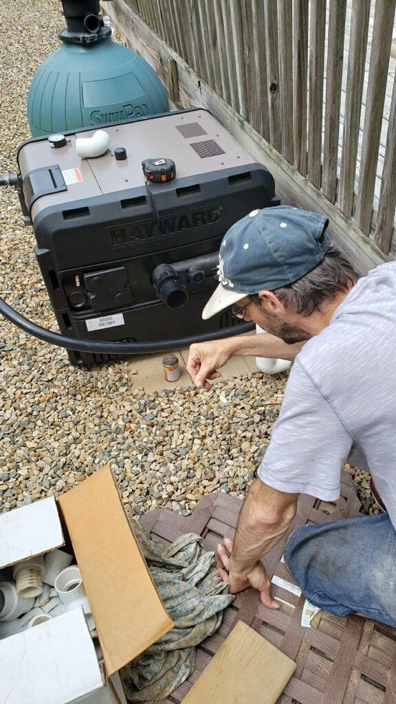 Man Checking the Pool Equipment — Portage, MI — Michigan Swim Pool & Spa