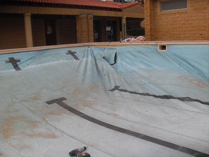 empty swimming pool with tarp