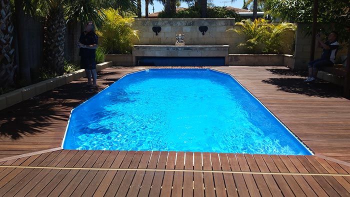 wood surface surrounding new pool
