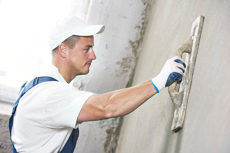 worker finishing the wall