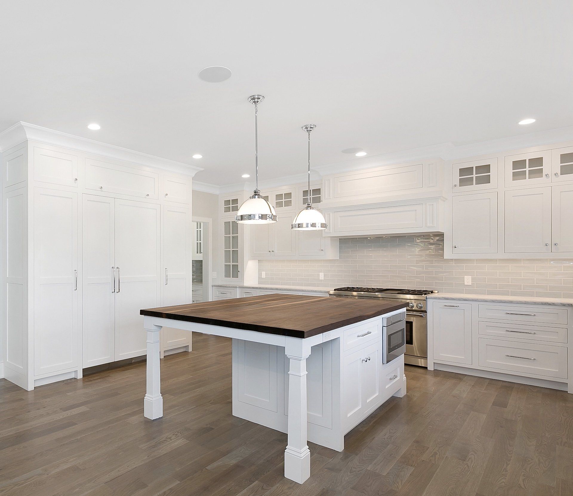 White Kitchen Cabinets & Backsplash with Island