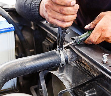 Expert repairing the radiator 