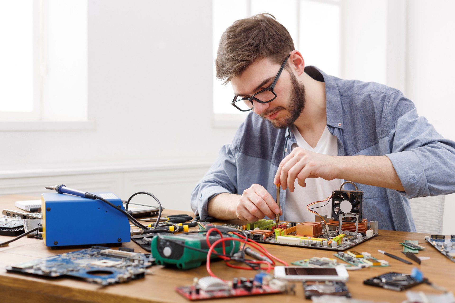 Repairman Disassemble Motherboard — East Longmeadow, MA — Affordable Expert Pc Services Repairman Disassemble Motherboard — East Longmeadow, MA — Affordable Expert Pc Services