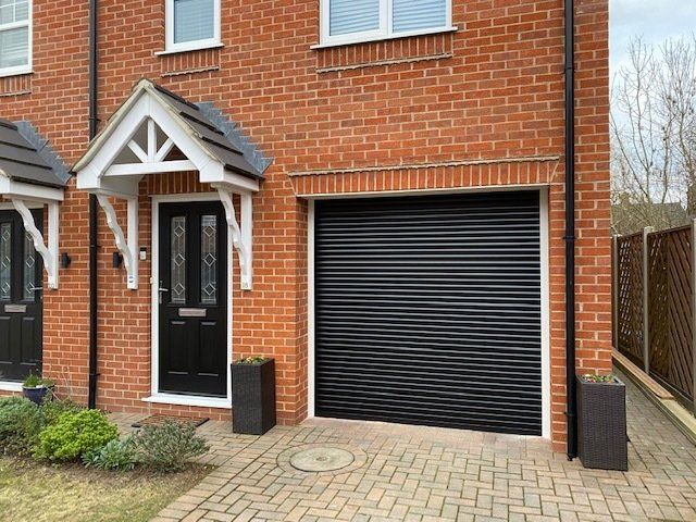 black single roller garage door on integrated garage