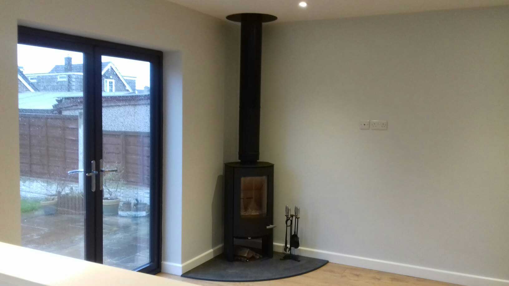 black fireplace in corner of room