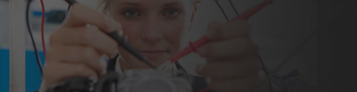 Woman working on an electric motor