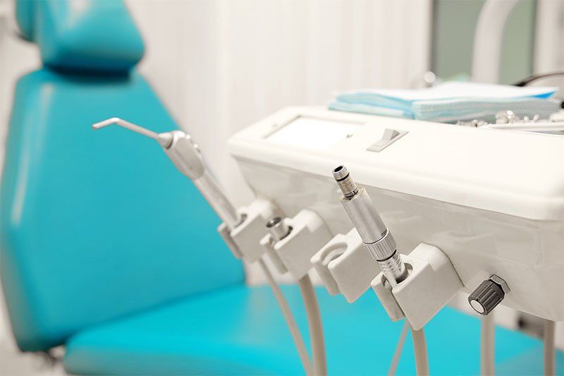 dental equipment dentist equipment with chair in background