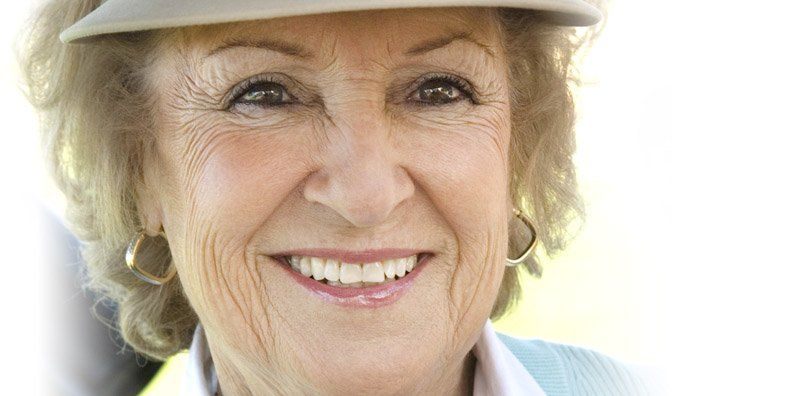 Check out our promotions mature woman smiling