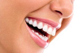 womans smile side view and closeup of woman smiling with bright teeth