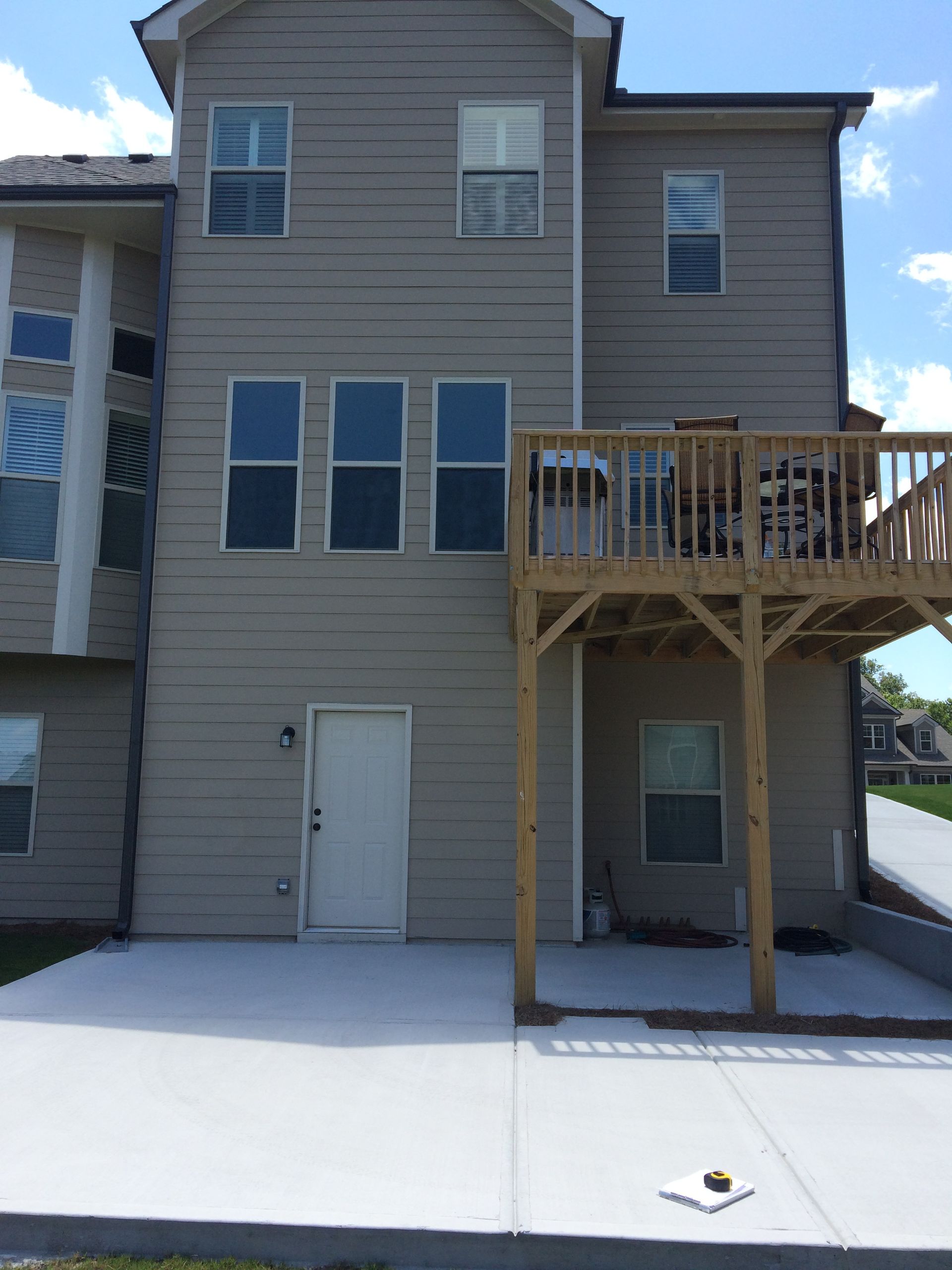 The front of a house with a wooden deck