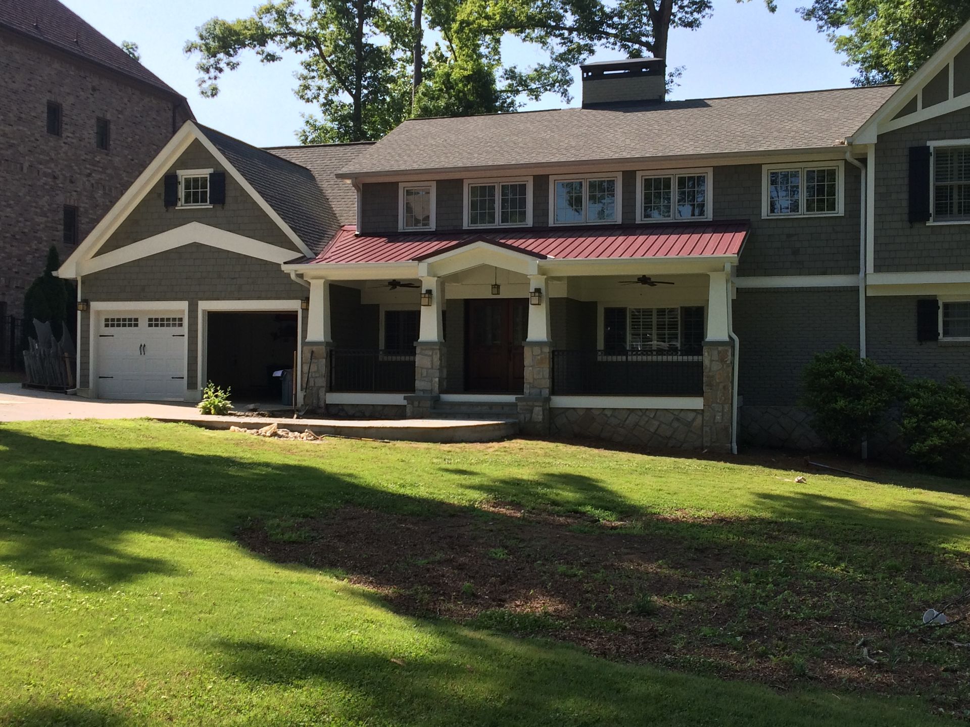 A large house with a large lawn in front of it