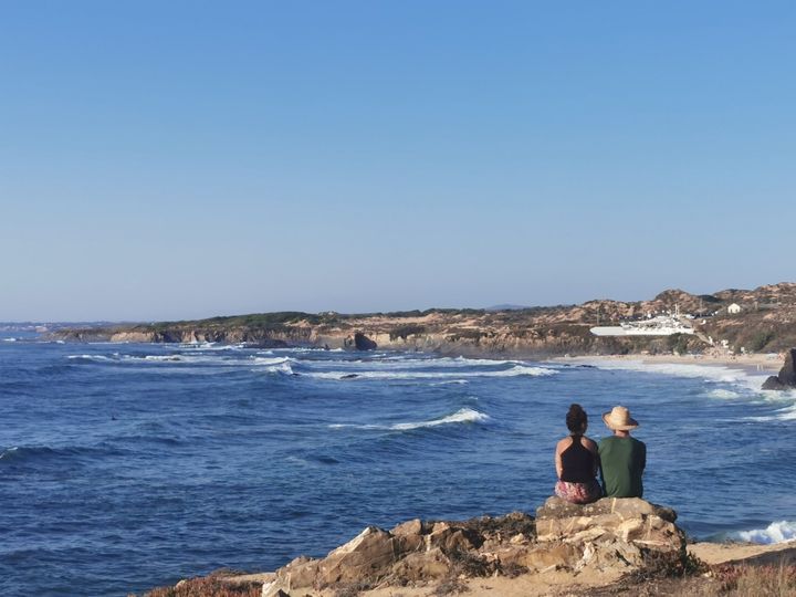 Visitors looking out over the Atlantic at Almograve on the Vicentine Coast