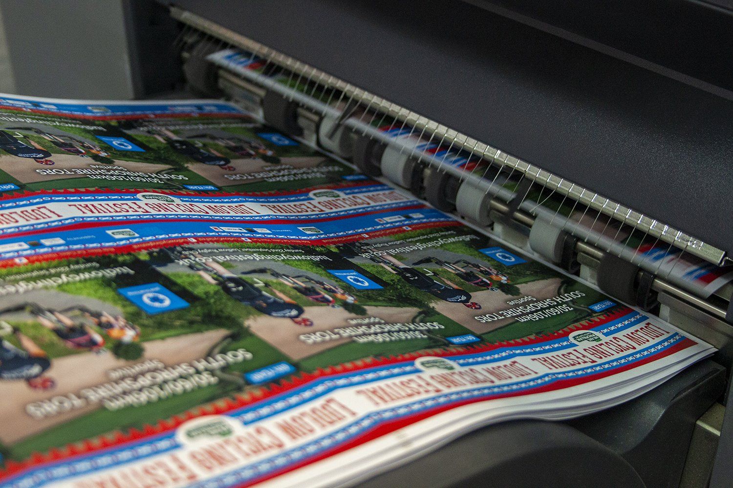 SRA3 paper coming out of a digital printer
