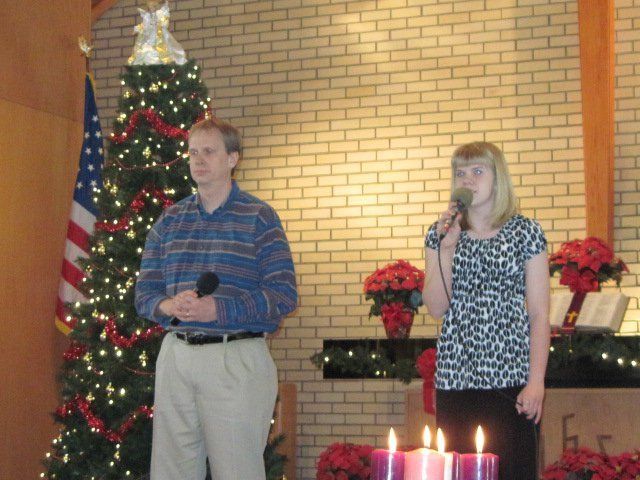 man and woman singing