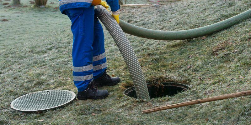 Worker Pumping the Septic Tank — Greenville, SC — American Waste Septic Worker Pumping the Septic Tank — Greenville, SC — American Waste Septic
