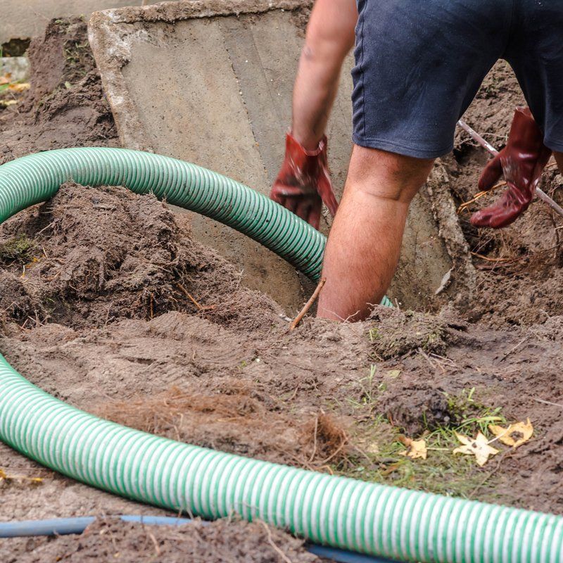 Man Pumping the Septic Tank — Greenville, SC — American Waste Septic